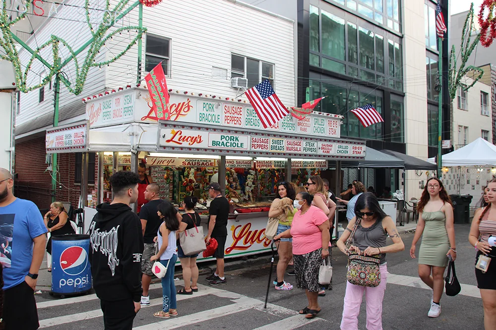 Lucy's Zeppole Stand juxtaposed against a new glass apartment building