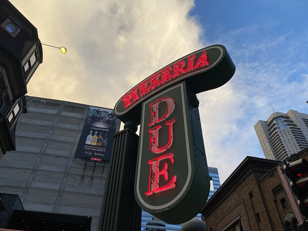 The neon sign of Pizzeria Due